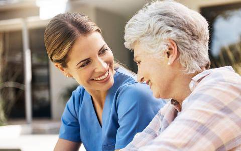 Physician Smiling at Senior