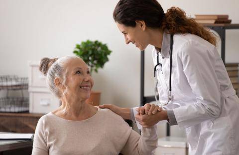 Doctor Holding Patient's Hand