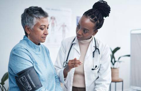 Doctor Taking Patient's Blood Pressure