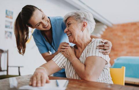 Doctor with Arms Around Patient