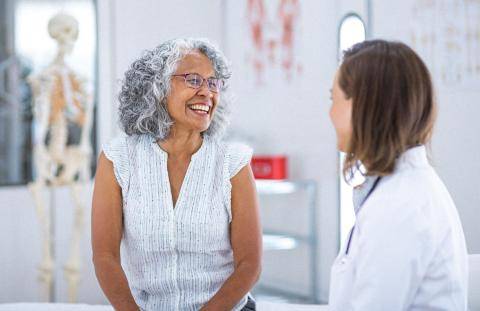 Senior Smiling at Doctor