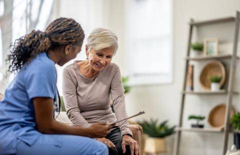 Physician Showing Chart to Senior Patient